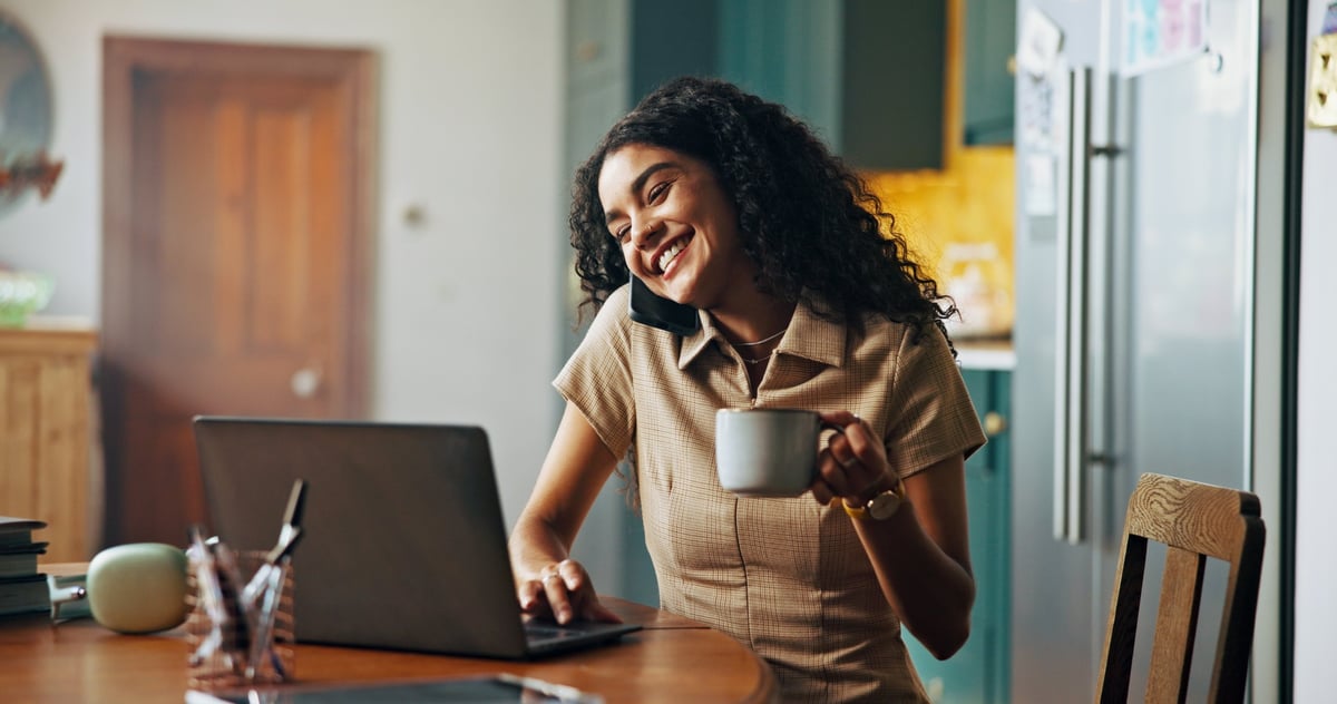 Kelley working from home with coffee, warm and welcoming
